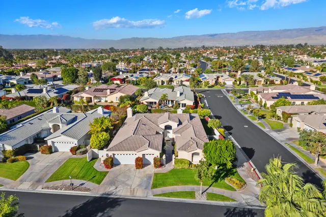 an aerial view of residential house with swimming pool