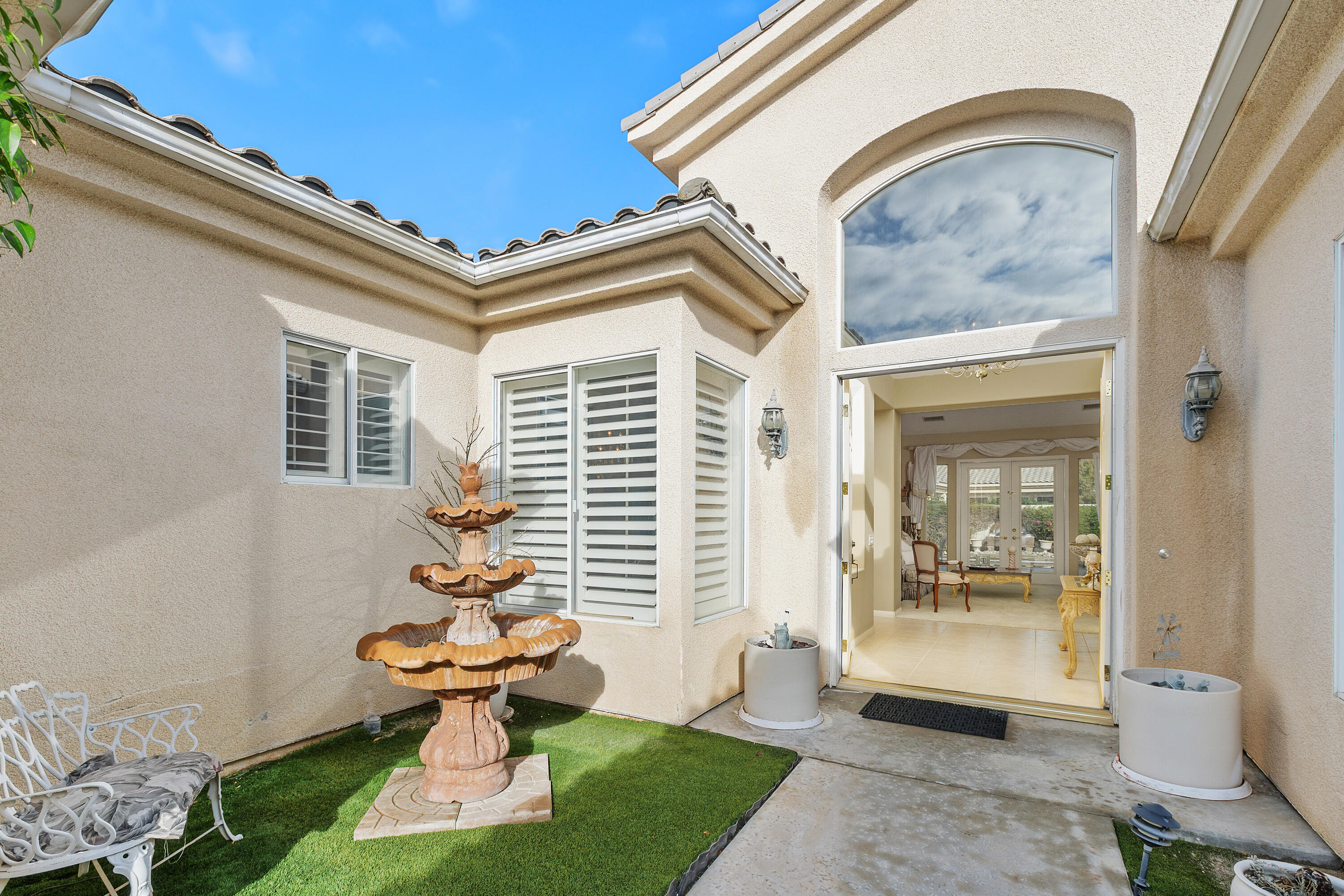 2 Othello Court Rancho Mirage, CA 92270 - Photo 6 of 45 a front view of a house with garden