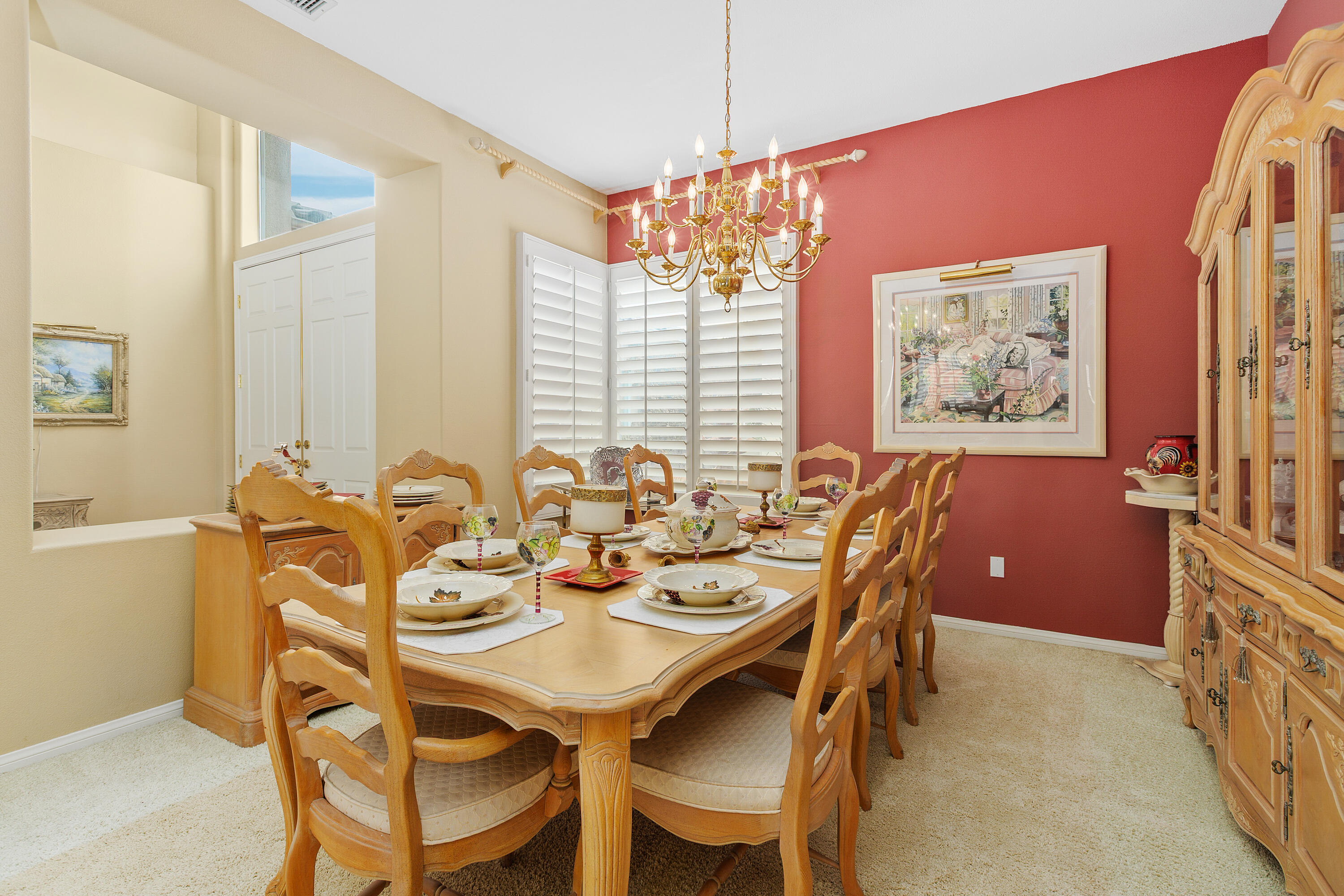 2 Othello Court Rancho Mirage, CA 92270 - Photo 8 of 45 a view of a dining room with furniture and chandelier