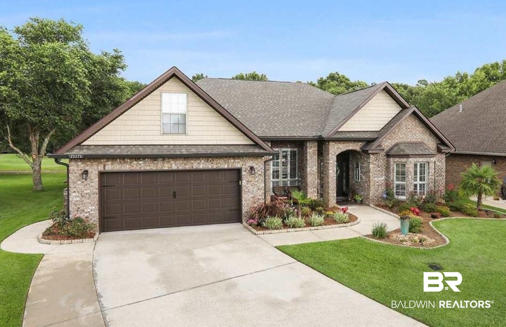 23373 Dundee Circle Foley, AL 36535 - Photo 1 of 34 View of front facade featuring a garage and a front yard