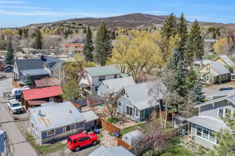 an aerial view of a house with a swimming pool