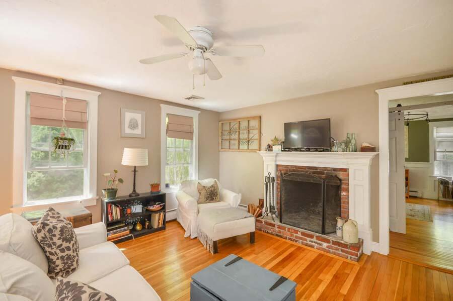 10 Meredith Road Forestdale, MA 02644 - Photo 4 of 29 a living room with furniture a flat screen tv and a fireplace