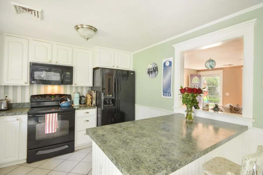 10 Meredith Road Forestdale, MA 02644 - Photo 7 of 29 a kitchen with stainless steel appliances granite countertop a refrigerator a stove and a sink