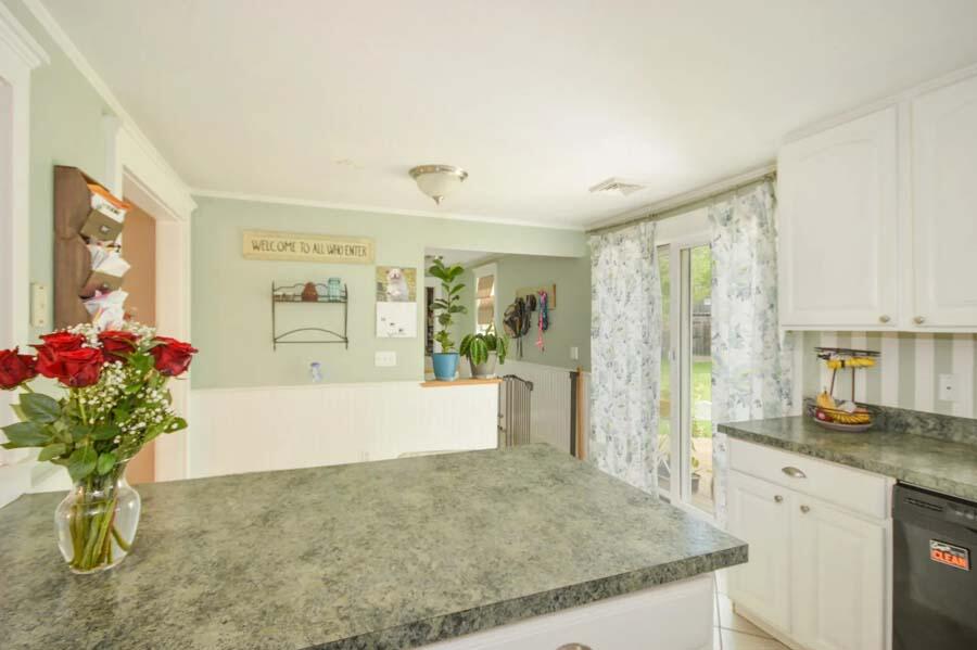 10 Meredith Road Forestdale, MA 02644 - Photo 8 of 29 a living room with kitchen island granite countertop furniture and flowers