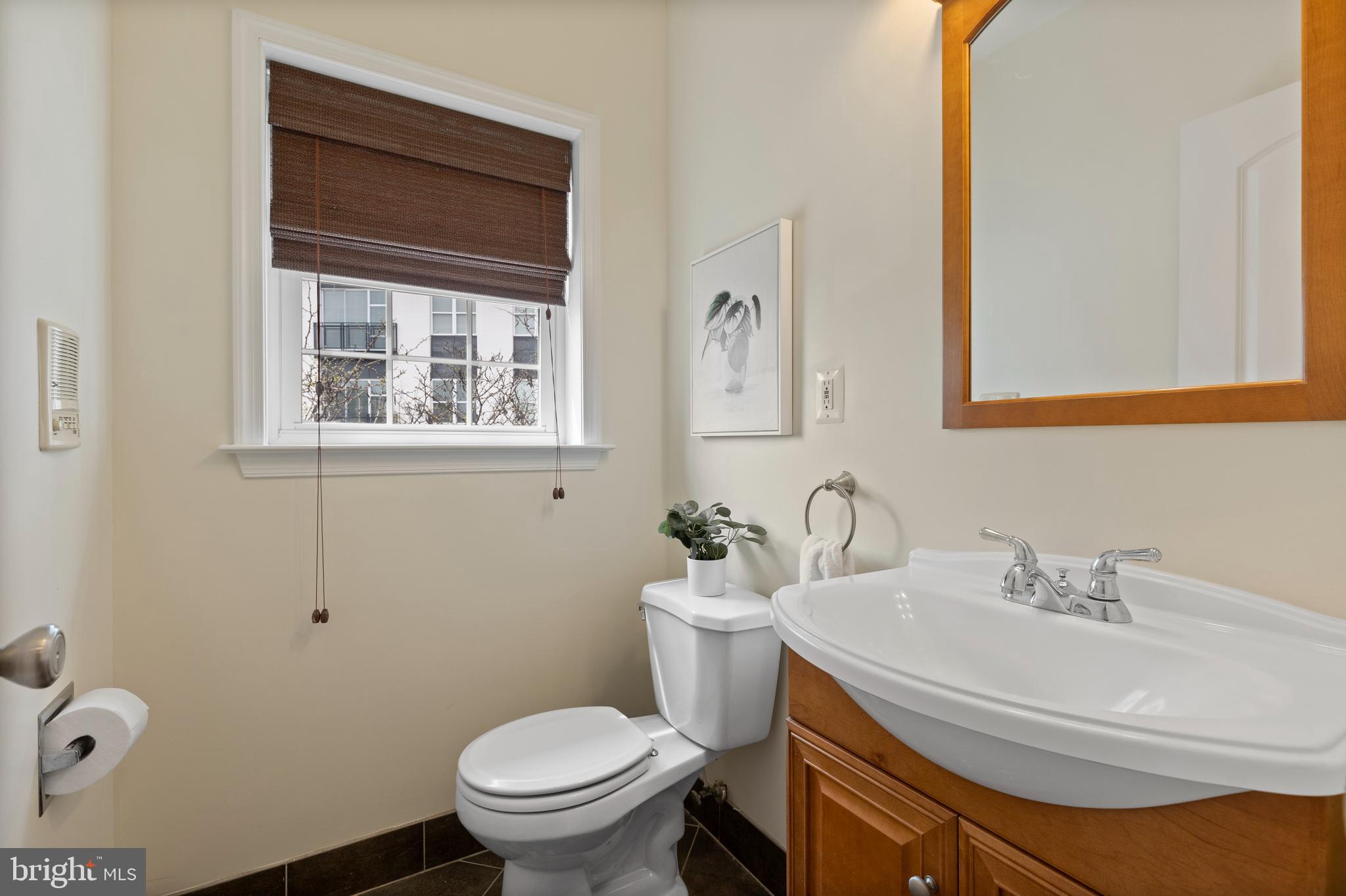 1125 Race Street Baltimore, MD 21230 - Photo 16 of 43 a bathroom with a sink toilet and a mirror