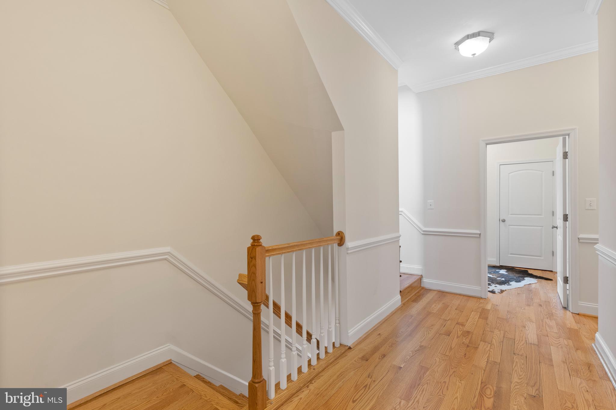 1125 Race Street Baltimore, MD 21230 - Photo 17 of 43 a view of a hallway with wooden floor and staircase