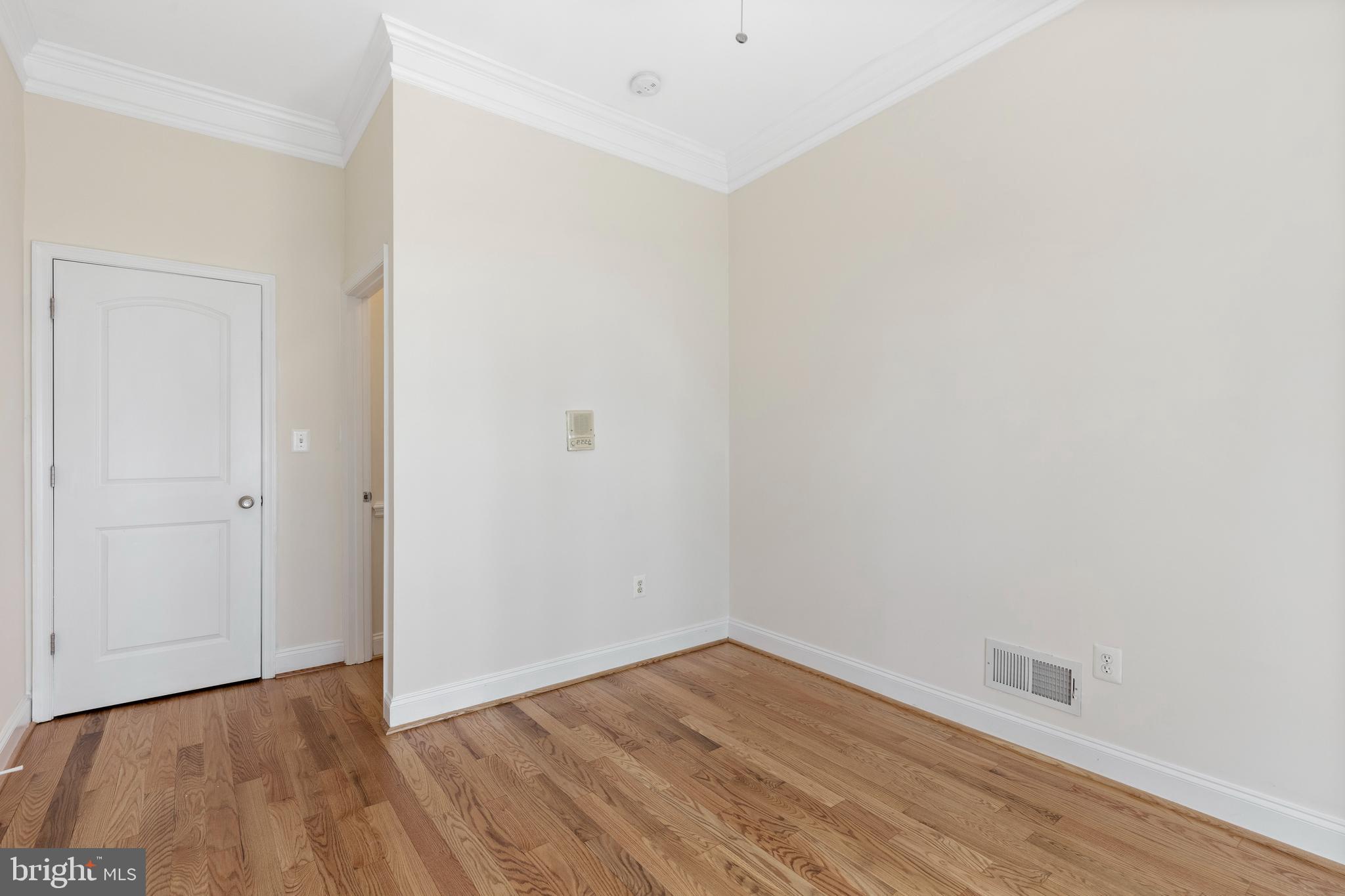 1125 Race Street Baltimore, MD 21230 - Photo 29 of 43 a view of an empty room with wooden floor