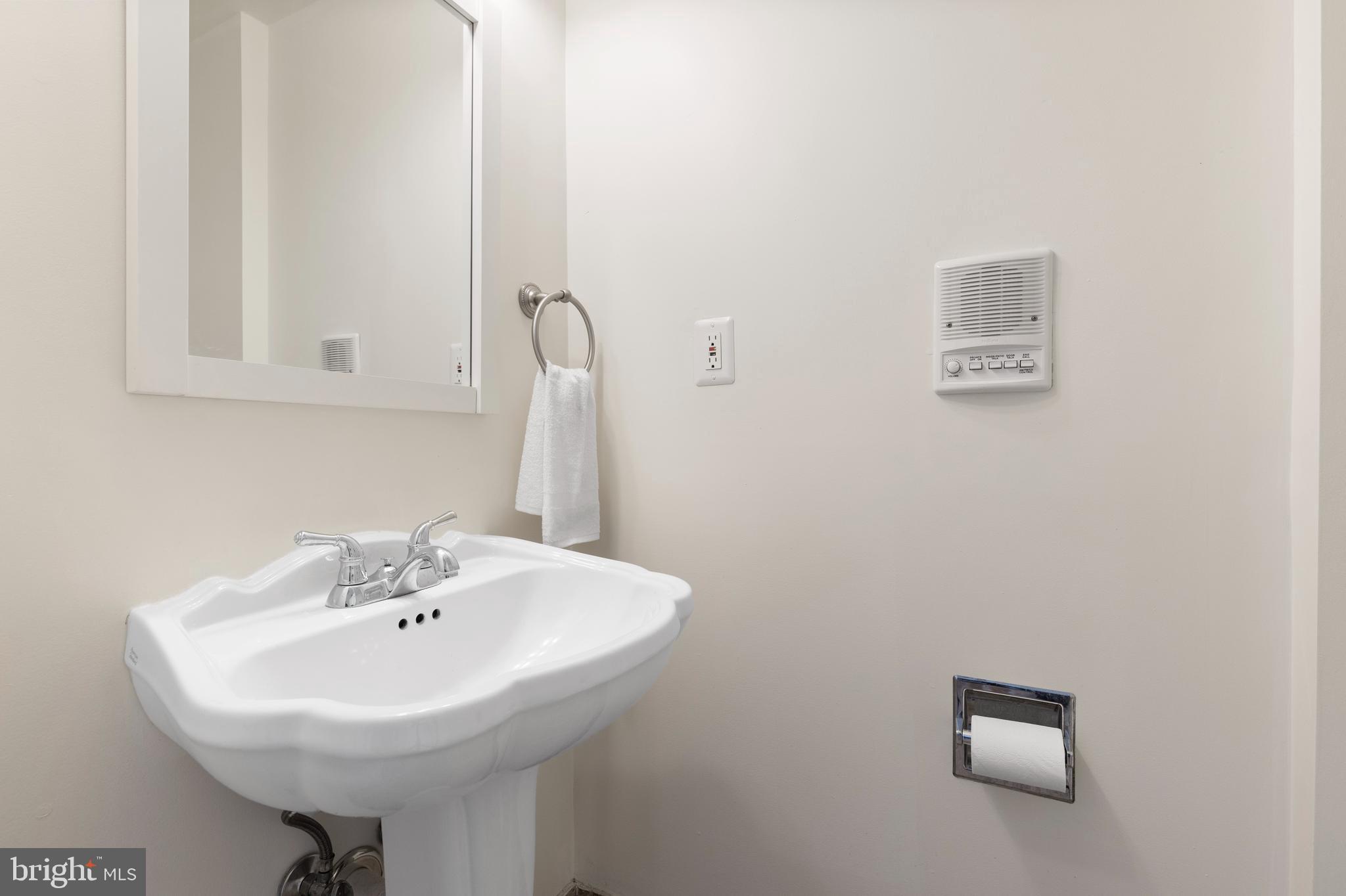 1125 Race Street Baltimore, MD 21230 - Photo 37 of 43 a bathroom with a sink a toilet and mirror