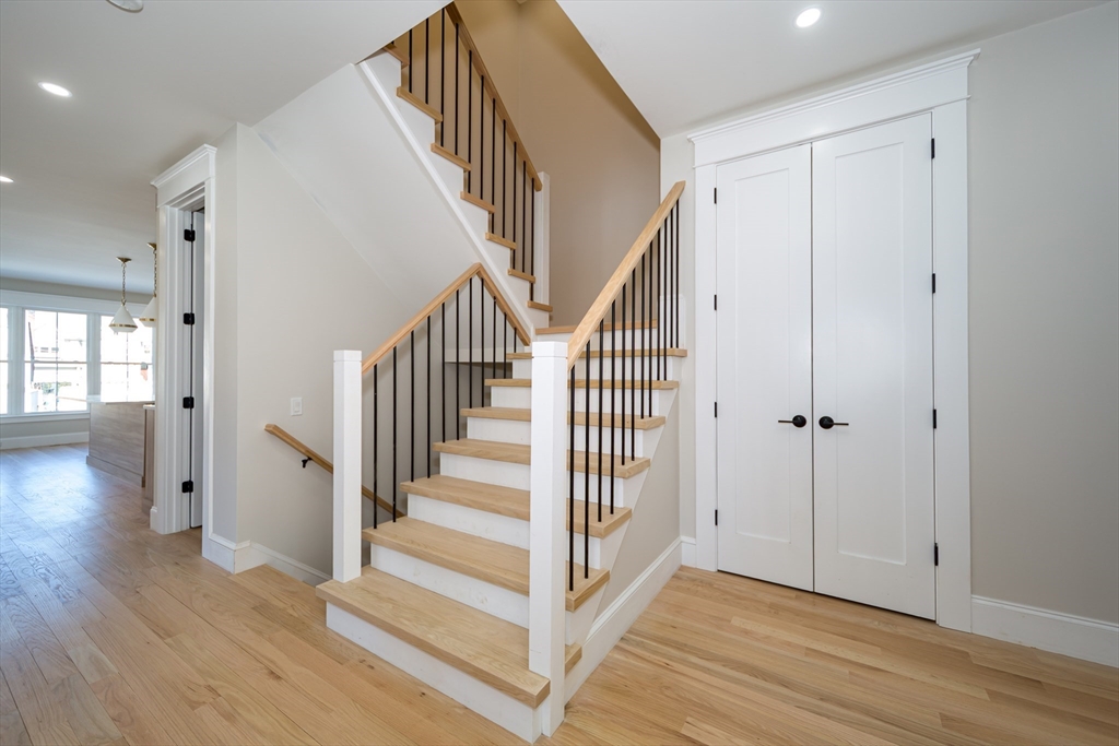 57 Beverly Road Natick, MA 01760 - Photo 11 of 20 a view of a hallway with wooden floor and entryway