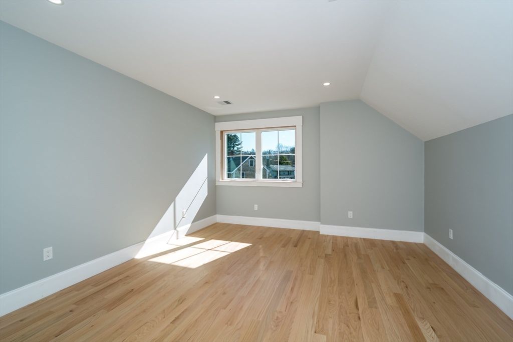 57 Beverly Road Natick, MA 01760 - Photo 15 of 20 wooden floor in an empty room with a window