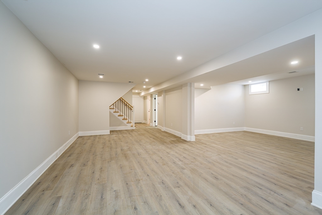 57 Beverly Road Natick, MA 01760 - Photo 19 of 20 an empty room with wooden floor and windows