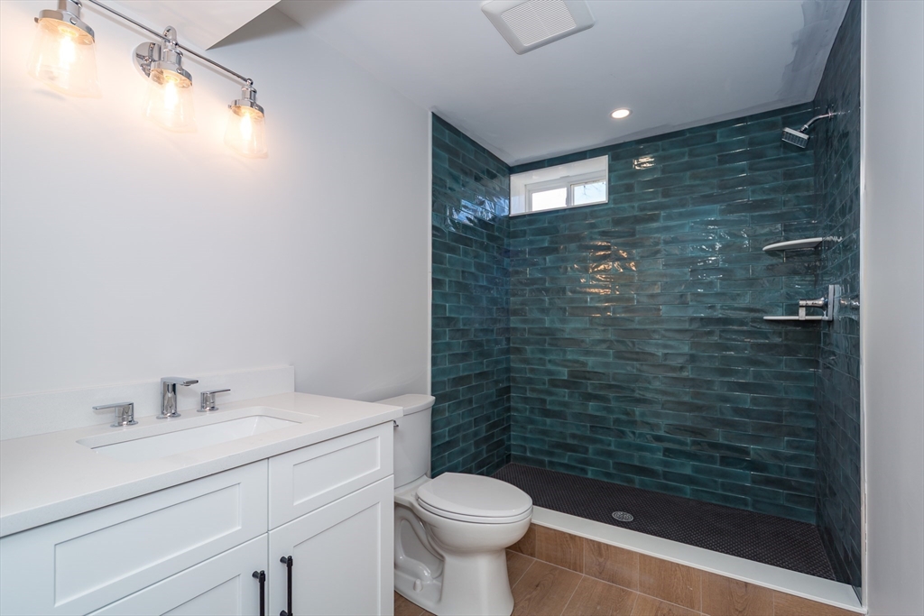 57 Beverly Road Natick, MA 01760 - Photo 20 of 20 a bathroom with a sink a toilet and shower