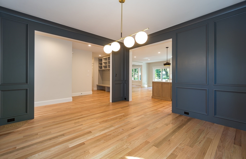 57 Beverly Road Natick, MA 01760 - Photo 5 of 20 a view of an empty room with window and wooden floor