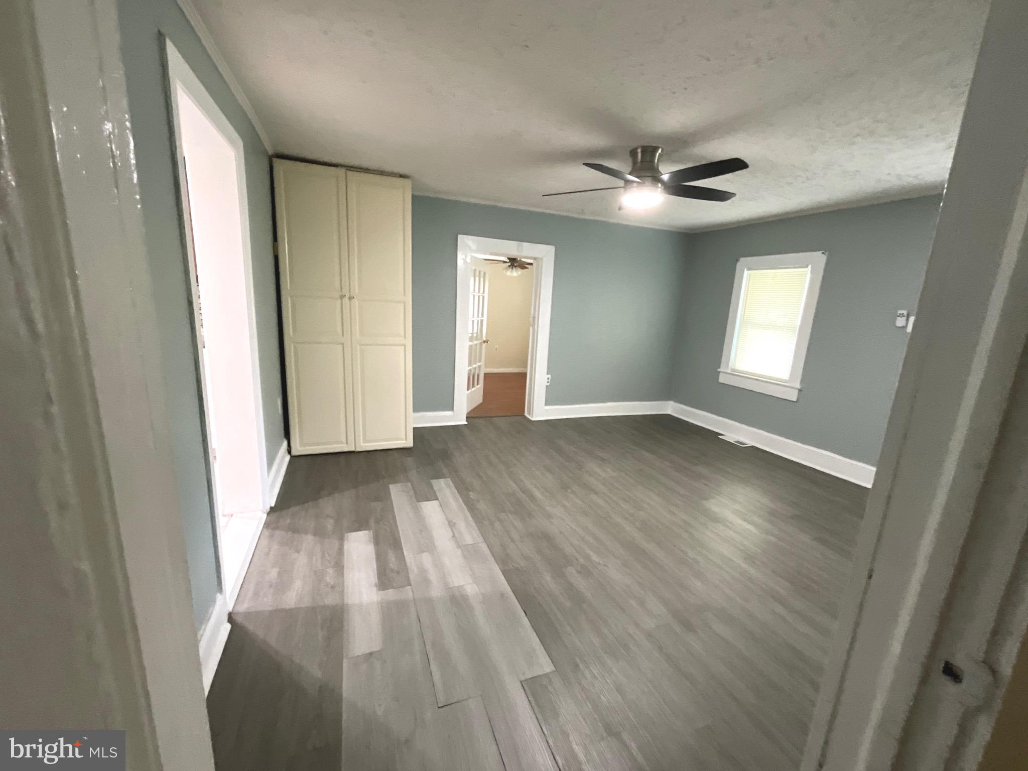 86 Kelley Road Fredericksburg, VA 22405 - Photo 7 of 36 wooden floor in an empty room with a window