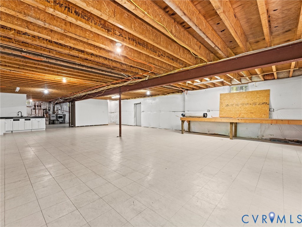 12 Henderson Road New Canton, VA 23123 - Photo 37 of 49 Expansive unfinished basement featuring an exposed