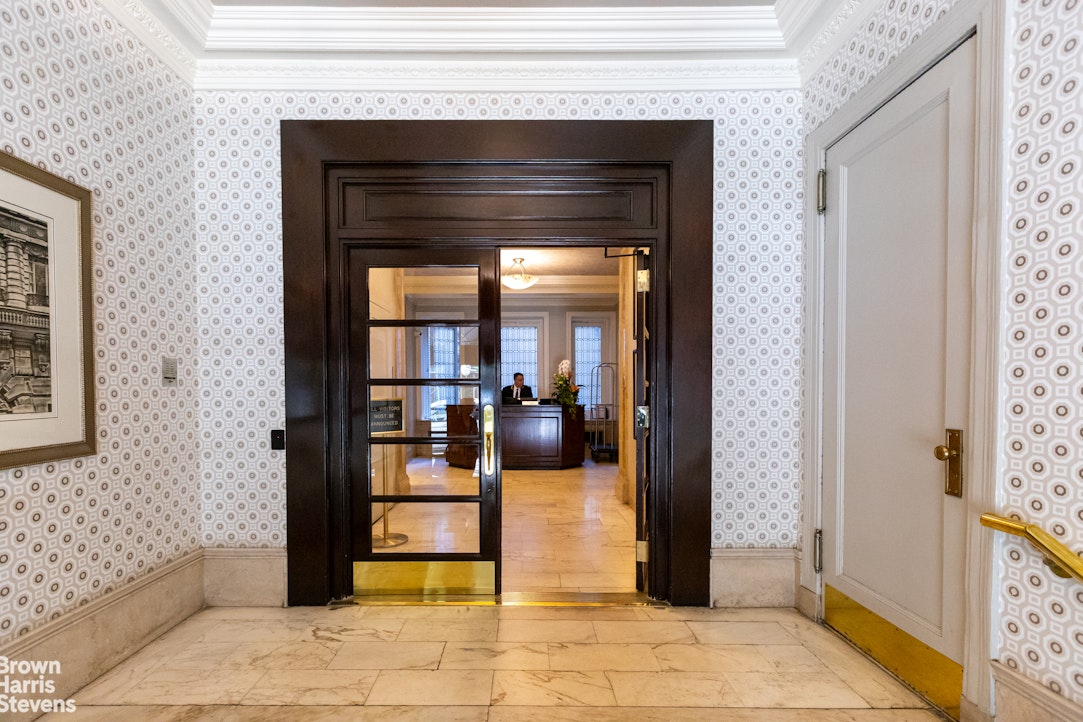 505 West End Avenue, Unit 4D Manhattan, NY 10024 - Photo 10 of 17 a living room with a furniture and a fireplace