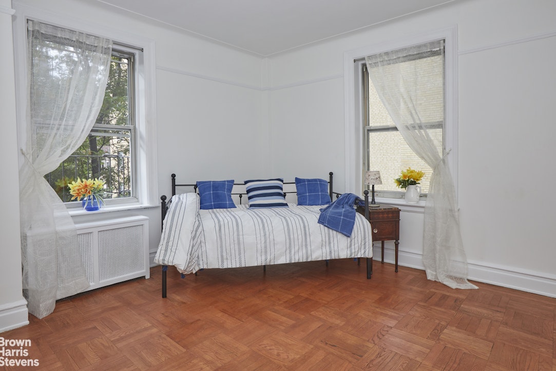505 West End Avenue, Unit 4D Manhattan, NY 10024 - Photo 4 of 17 a bedroom with a bed and a window