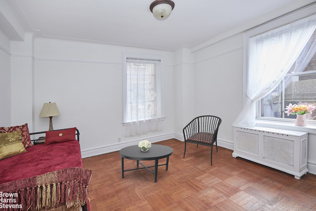 505 West End Avenue, Unit 4D Manhattan, NY 10024 - Photo 5 of 17 a view of a workspace with furniture and a window