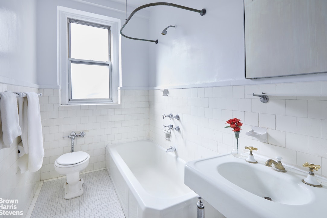 505 West End Avenue, Unit 4D Manhattan, NY 10024 - Photo 9 of 17 a bathroom with a sink toilet and shower