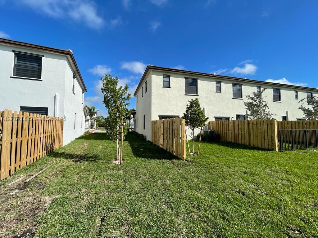 10144 Southwest 228th Terrace Miami, FL 33190 - Photo 21 of 23 a view of a house with backyard
