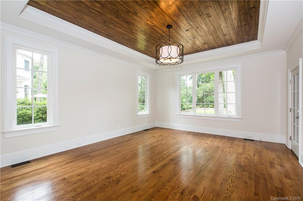 2308 Vernon Drive Charlotte, NC 28211 - Photo 11 of 24 an empty room with wooden floor and window