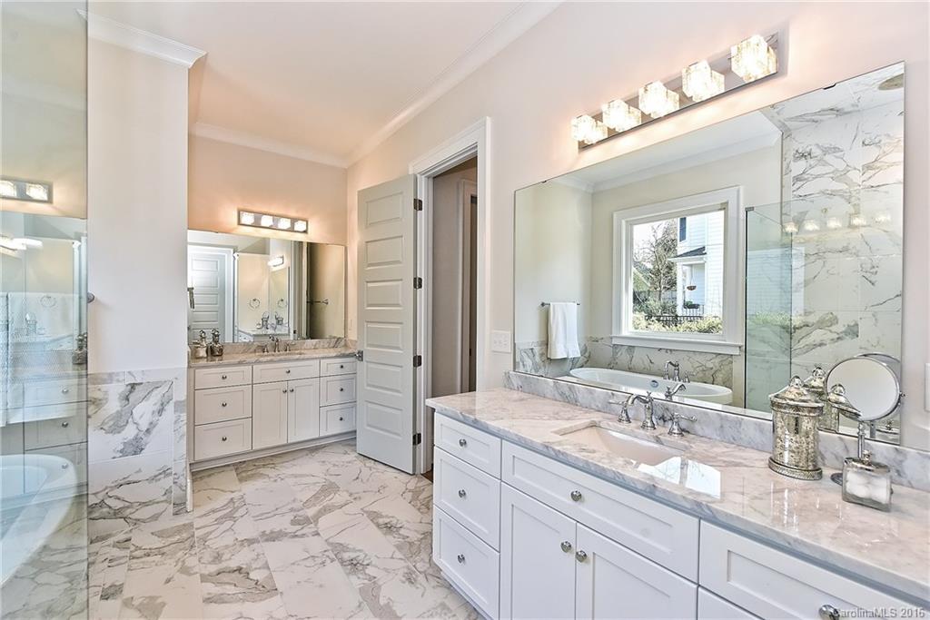 2308 Vernon Drive Charlotte, NC 28211 - Photo 13 of 24 a spacious bathroom with a granite countertop sink mirror and bathtub