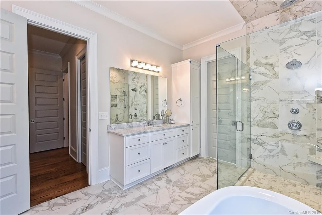 2308 Vernon Drive Charlotte, NC 28211 - Photo 14 of 24 a bathroom with a granite countertop sink mirror and shower