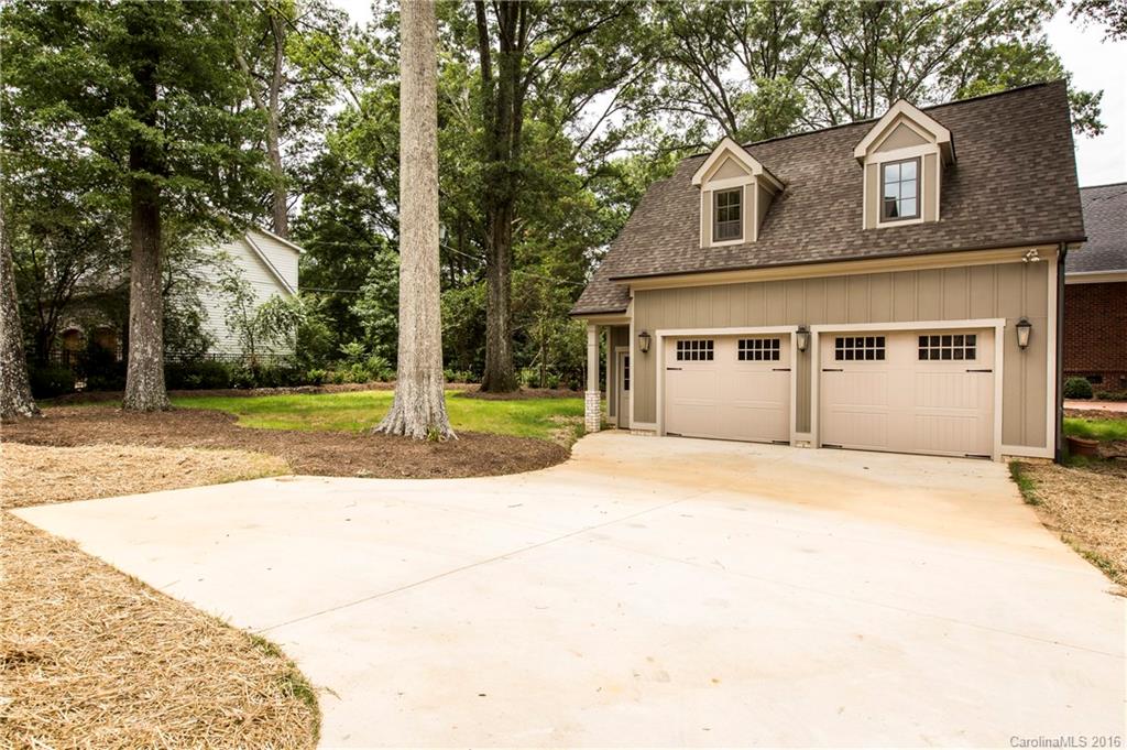 2308 Vernon Drive Charlotte, NC 28211 - Photo 23 of 24 a front view of a house with a yard and garage