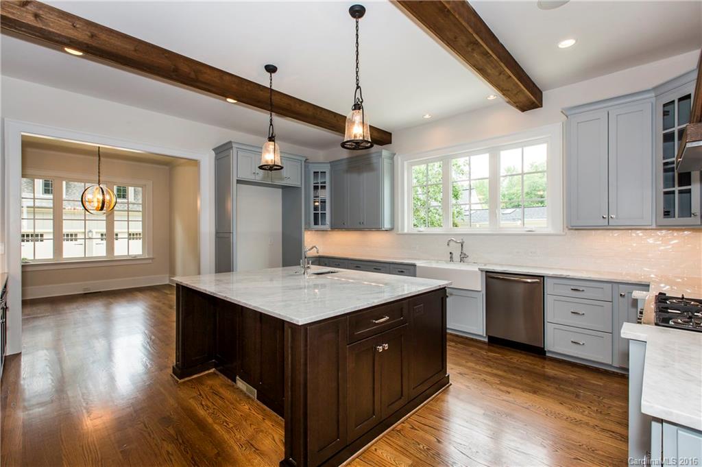 2308 Vernon Drive Charlotte, NC 28211 - Photo 6 of 24 a kitchen with a stove sink and cabinets