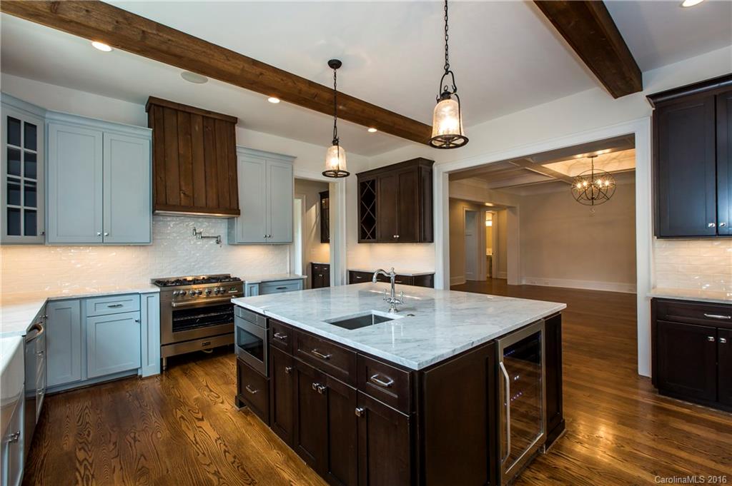 2308 Vernon Drive Charlotte, NC 28211 - Photo 7 of 24 a kitchen with a stove a sink and a refrigerator