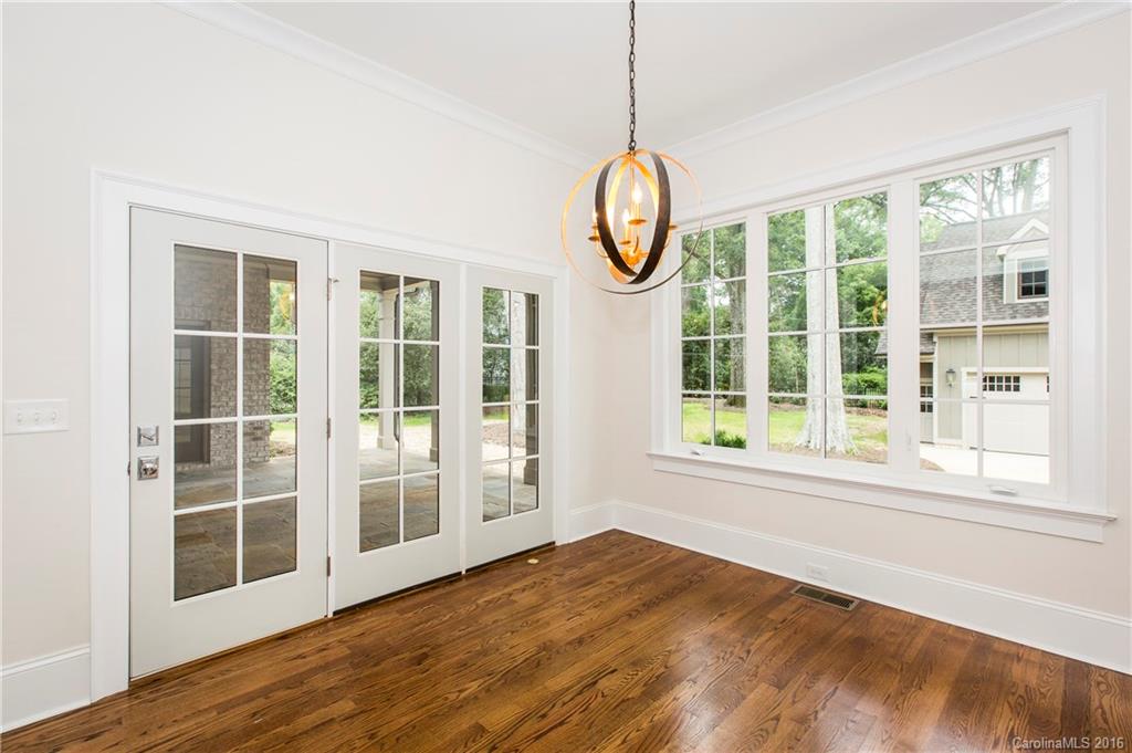 2308 Vernon Drive Charlotte, NC 28211 - Photo 8 of 24 a view of empty room with wooden floor and fan