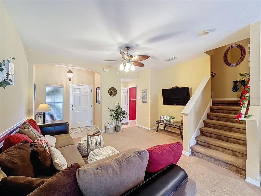 11807 Castine Street New Port Richey, FL 34654 - Photo 3 of 40 a living room with furniture and a chandelier