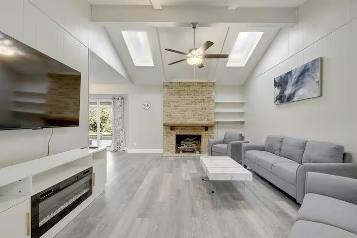 a living room with furniture and a fireplace