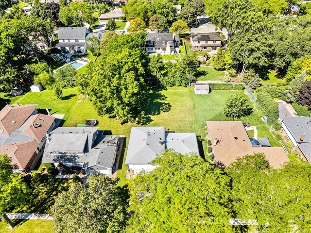 an aerial view of a house with swimming pool