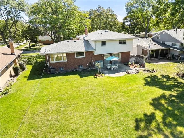an aerial view of residential houses with outdoor space