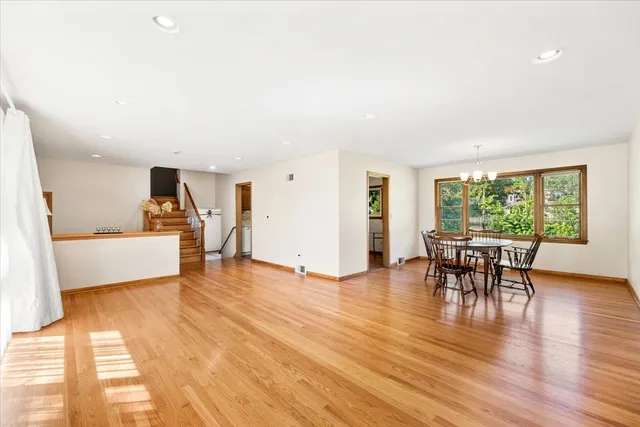 a view of a livingroom with furniture window and wooden floor