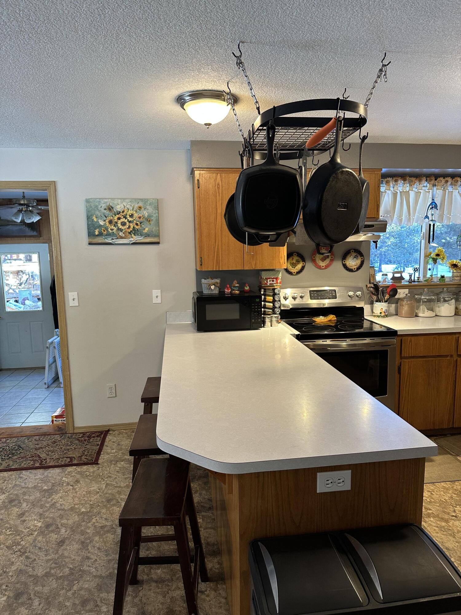 123977 Surveyor Road Crescent Lake, OR 97733 - Photo 19 of 41 a kitchen with a table and chairs