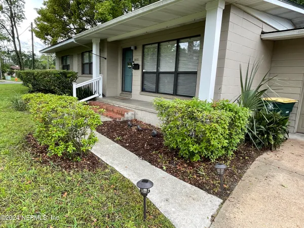 front view of a house with a small yard