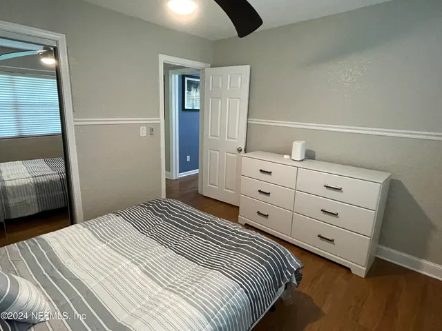 a bedroom with a bed and a walk in closet