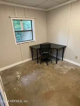 a room with furniture and a window