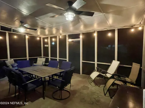 a view of a dining room with furniture window and outside view