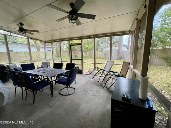 a view of a dining room with furniture window and outside view
