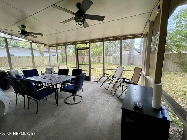 a view of a dining room with furniture window and outside view