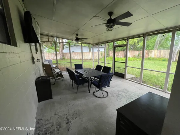 a view of a livingroom with furniture and a window