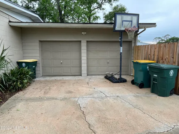a couple of potted plants in front of door