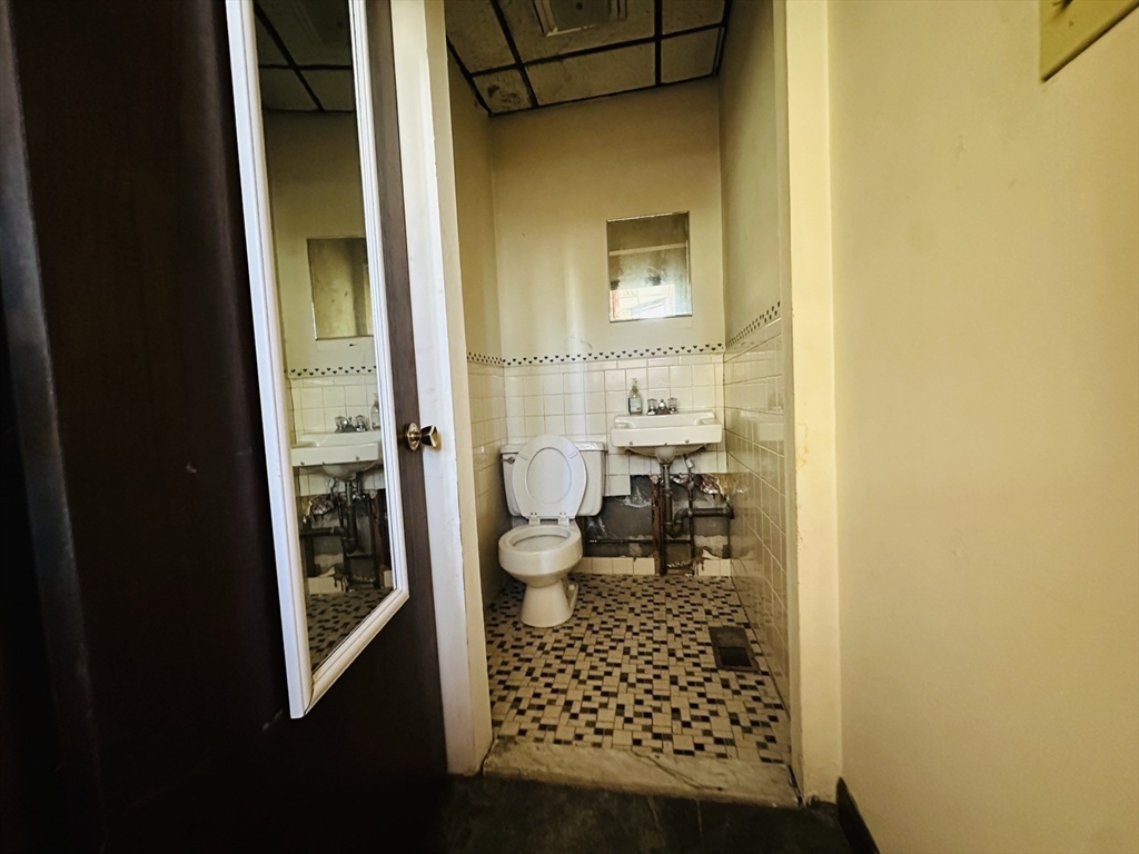 77 Forest Street Watertown, MA 02472 - Photo 8 of 10 a bathroom with a toilet