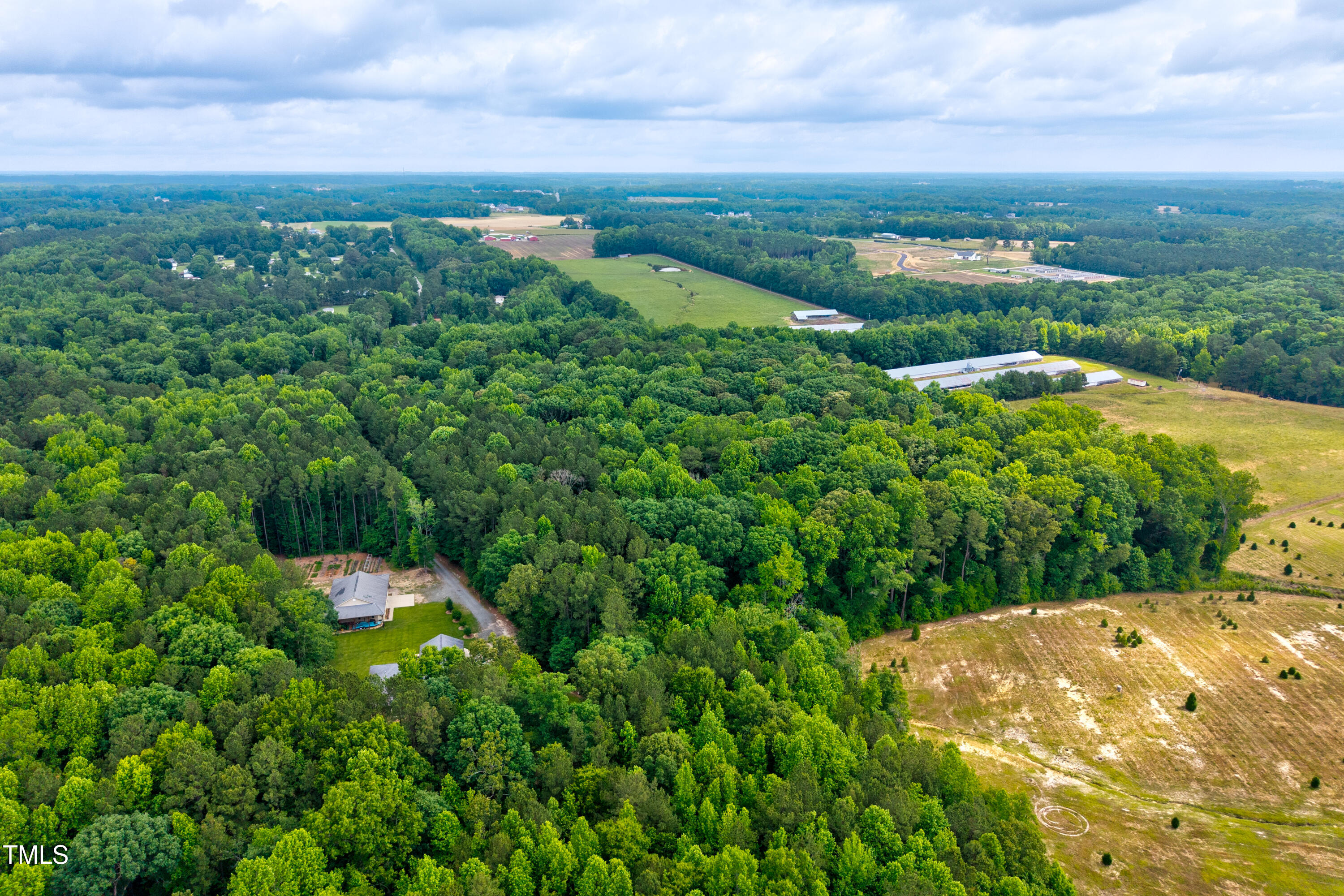 9212 Four Sisters Lane Willow Spring, NC 27592 - Photo 7 of 8 a view of a lush green space with sea