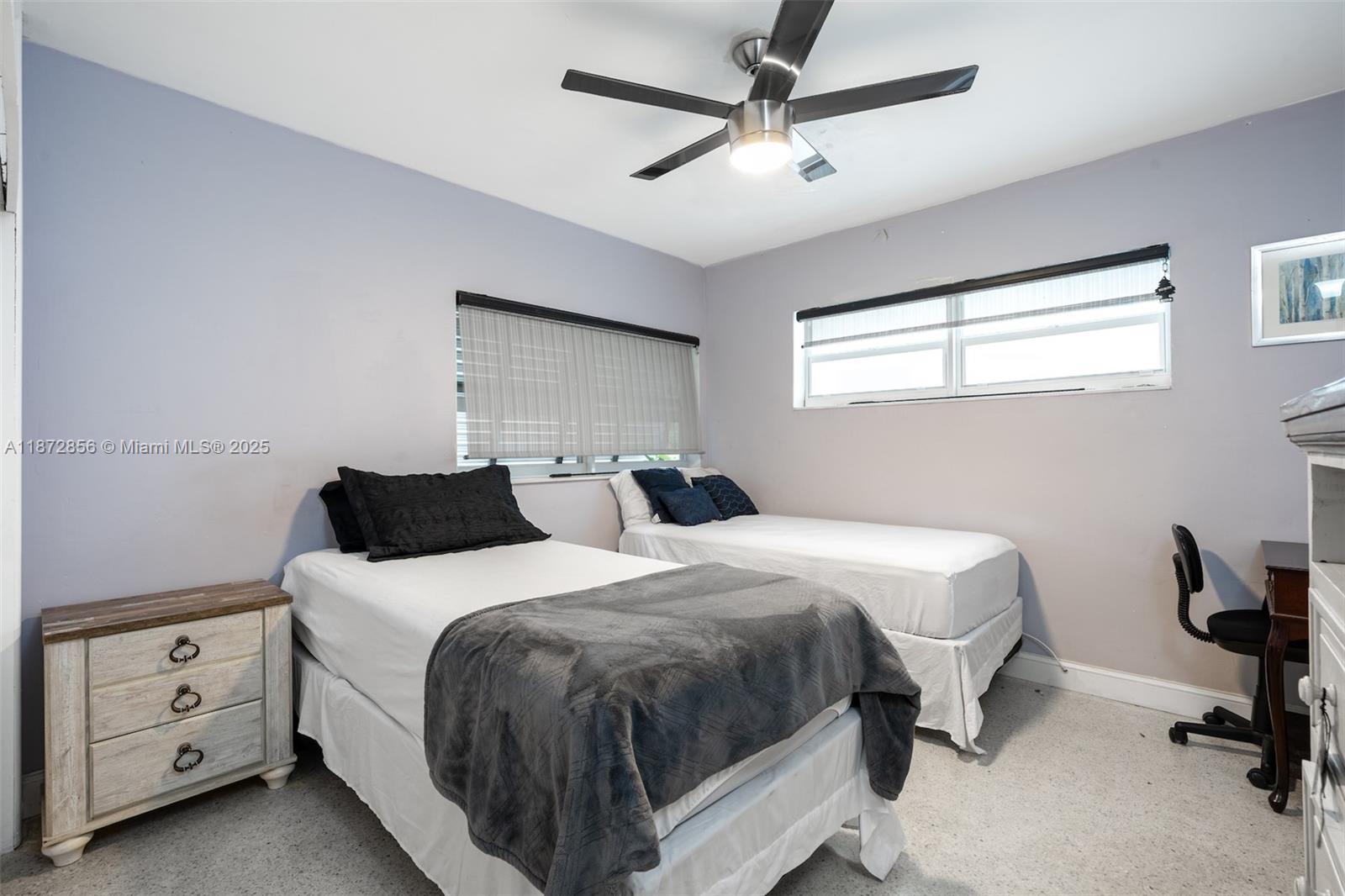 18525 Northwest 39th Avenue Miami Gardens, FL 33055 - Photo 11 of 11 a bedroom with a bed and a chandelier