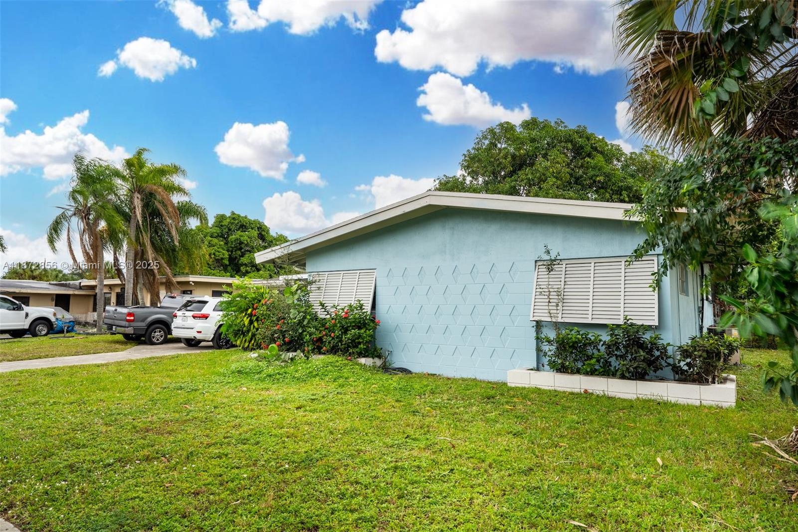 18525 Northwest 39th Avenue Miami Gardens, FL 33055 - Photo 2 of 11 a view of backyard with a garden and plants