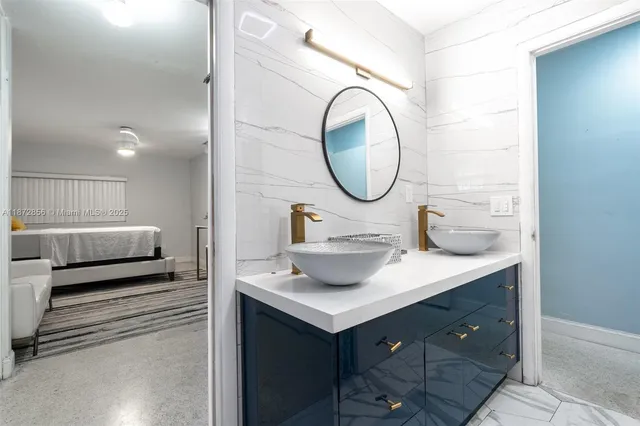 a bathroom with a sink and a mirror